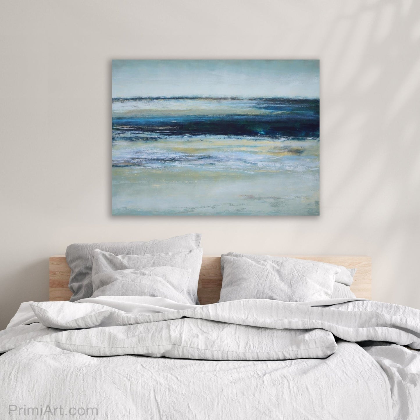 indigo and yellow coastal artwork in bedroom