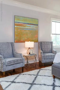 Zen abstract coastal wall art "Amber Keys," downloadable art by Victoria Primicias, decorates the bedroom.