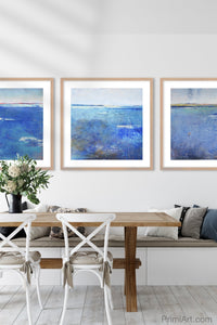 Coastal blue abstract seascape painting "Aegean Crossing," wall art print by Victoria Primicias, decorates the dining room.