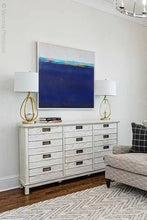 Load image into Gallery viewer, Navy blue abstract beach wall decor &quot;After Hours,&quot; downloadable art by Victoria Primicias, decorates the living room.
