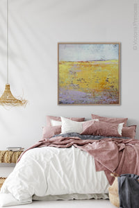 Bright landscape painting "Amalfi Sound," digital art by Victoria Primicias, decorates the bedroom.