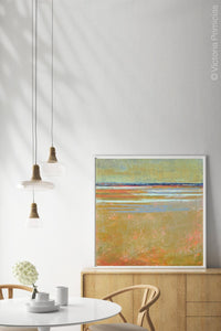 Golden abstract beach wall art "Amber Keys," canvas art print by Victoria Primicias, decorates the dining room.