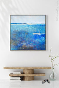 Blue abstract beach wall decor "Arctic Tidings," metal print by Victoria Primicias, decorates the entryway.