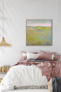 Yellow green abstract landscape painting "Bellini Fields," digital print by Victoria Primicias, decorates the bedroom.