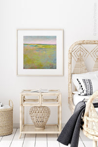 Yellow green abstract landscape painting "Bellini Fields," digital download by Victoria Primicias, decorates the bedroom.