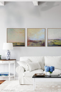 Unique abstract coastal wall art "Blue Promise," canvas wall art by Victoria Primicias, decorates the living room.
