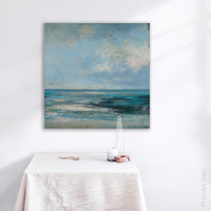 blue abstract seascape painting above kitchen table