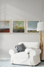 Load image into Gallery viewer, Square abstract coastal wall art &quot;Blushing Silence,&quot; canvas print by Victoria Primicias, decorates the living room.

