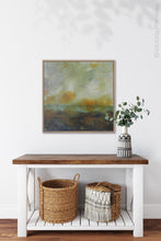 Load image into Gallery viewer, Square abstract landscape painting &quot;Blushing Silence,&quot; canvas wall art by Victoria Primicias, decorates the entryway.
