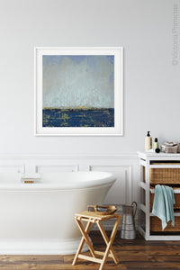 Indigo blue abstract seascape painting "Broken Rules," digital download by Victoria Primicias, decorates the bathroom.