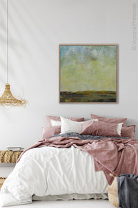 Square abstract landscape art "Canary Winds," digital print by Victoria Primicias, decorates the bedroom.