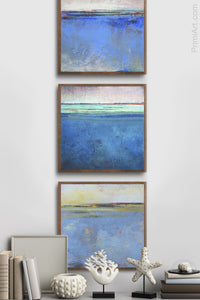 Blue abstract beach art "Carolina Shores," metal print by Victoria Primicias, decorates the hallway.