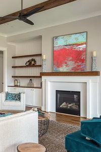 Colorful abstract ocean art "Cerise Harbor," digital artwork by Victoria Primicias, decorates the fireplace.