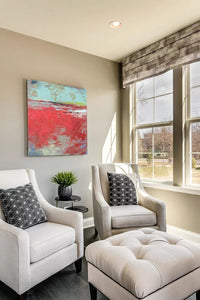 Red abstract landscape art "Cerise Harbor," canvas art print by Victoria Primicias, decorates the living room.