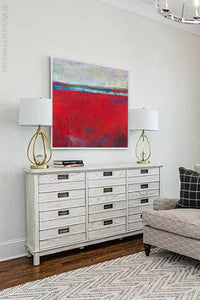 Bold abstract beach wall decor "Cherry Hollow," digital print by Victoria Primicias, decorates the living room.