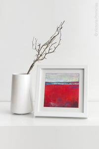 Red abstract seascape painting "Cherry Hollow," fine art print by Victoria Primicias, decorates the shelf.