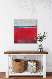Red abstract seascape painting "Cherry Hollow," fine art print by Victoria Primicias, decorates the entryway.