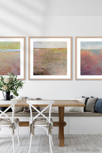 Pink abstract beach wall art "Cherry Inlet," printable wall art by Victoria Primicias, decorates the dining room.