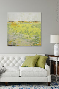 Bright abstract landscape painting "Citrus Morning," digital print by Victoria Primicias, decorates the living room.