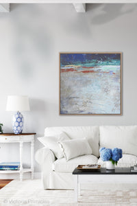 Modern abstract beach wall art "Cobalt Chorus," wall art print by Victoria Primicias, decorates the living room.