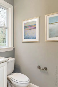 Square abstract seascape painting "Common Threads," digital download by Victoria Primicias, decorates the bathroom.