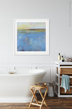 Load image into Gallery viewer, Blue abstract beach wall decor &quot;Daily Caller,&quot; metal print by Victoria Primicias, decorates the bathroom.
