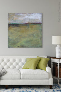 Square abstract beach artwork "Dijon Dunes," digital download by Victoria Primicias, decorates the living room.