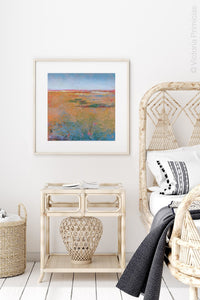 Colorful abstract coastal wall decor "Dusty Sunrise," printable wall art by Victoria Primicias, decorates the bedroom.