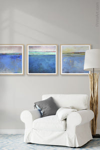 Blue impressionist abstract beach wall decor "Evening Veil," digital download by Victoria Primicias, decorates the living room.