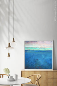 Blue impressionist abstract beach wall decor "Evening Veil," digital download by Victoria Primicias, decorates the dining room.