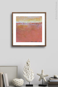 Red orange abstract beach art "Fading Beauty," digital art landscape by Victoria Primicias, decorates the wall.