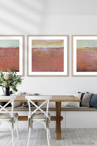 Red orange abstract beach wall art "Fading Beauty," printable art by Victoria Primicias, decorates the dining room.