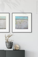 Load image into Gallery viewer, Serene abstract beach wall decor &quot;Finnish Line,&quot; downloadable art by Victoria Primicias, decorates the entryway.
