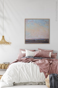 Large abstract landscape art "Flaming June," printable wall art by Victoria Primicias, decorates the bedroom.