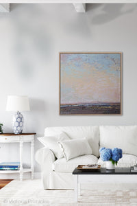 Large abstract landscape painting "Flaming June," printable wall art by Victoria Primicias, decorates the living room.