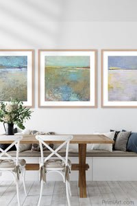 Large abstract landscape art "Floating Gallery," digital print by Victoria Primicias, decorates the dining room.