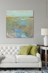 Large abstract landscape painting "Floating Gallery," digital print by Victoria Primicias, decorates the living room.