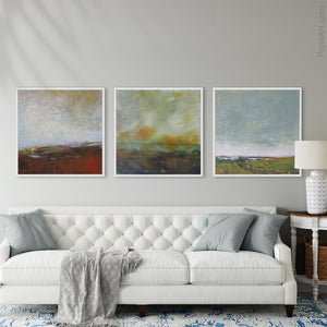 Serene abstract coastal wall decor "Golden Lining," digital print by Victoria Primicias, decorates the living room.