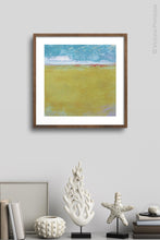 Load image into Gallery viewer, Gold coastal abstract coastal wall decor &quot;Golden Passage,&quot; digital download by Victoria Primicias, decorates the wall.
