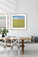 Load image into Gallery viewer, Gold coastal abstract coastal wall decor &quot;Golden Passage,&quot; digital download by Victoria Primicias, decorates the dining room.
