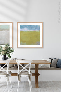 Gold coastal abstract coastal wall decor "Golden Passage," digital download by Victoria Primicias, decorates the dining room.