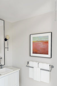 Square abstract coastal wall art "Golden Voyage," digital download by Victoria Primicias, decorates the bathroom.