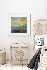 Coastal yellow abstract beach wall decor "Guardian Light," digital print by Victoria Primicias, decorates the bedroom.