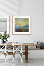 Load image into Gallery viewer, Coastal yellow abstract beach wall decor &quot;Guardian Light,&quot; digital download by Victoria Primicias, decorates the dining room.
