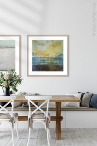 Coastal yellow abstract beach wall decor "Guardian Light," digital download by Victoria Primicias, decorates the dining room.