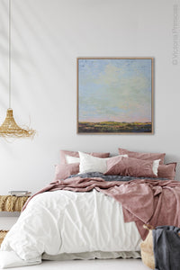 Blue abstract beach artwork "Hello Again," downloadable art by Victoria Primicias, decorates the bedroom.