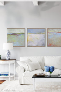 Yellow and gray abstract beach artwork "Inner Ocean," fine art print by Victoria Primicias, decorates the living room.