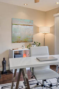 Neutral color abstract landscape art "Ivory Shore," digital print by Victoria Primicias, decorates the office.