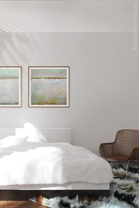 Gray abstract landscape art "Ivory Shore," giclee print by Victoria Primicias, decorates the bedroom.