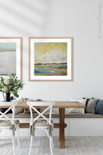 Load image into Gallery viewer, Coastal landscape painting &quot;Lapping Layers,&quot; digital download by Victoria Primicias, decorates the dining room.

